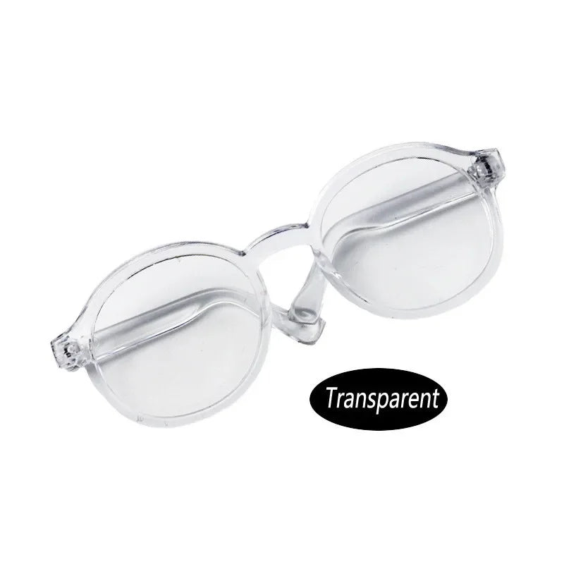 Clear plastic sunglasses designed for dolls, available in 15cm and 20cm sizes.
