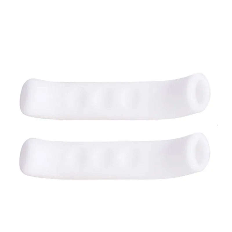 A pair of white silicone bicycle brake lever covers.