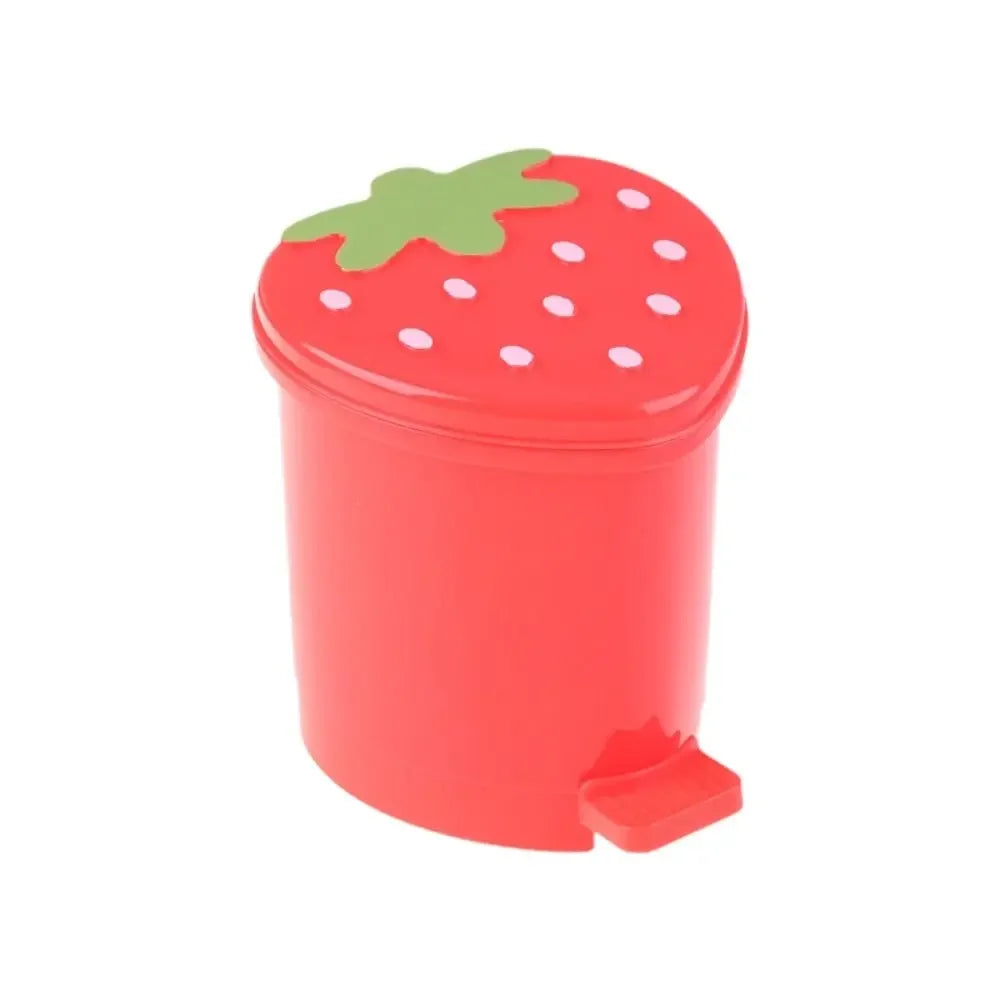 A red mini strawberry trash can with a green pop-up lid.