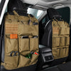 A tactical seat back organizer with seven pockets in camouflage fabric is shown inside a car seat.