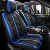 Black car seat covers with blue stitching and accents installed in a vehicle interior.