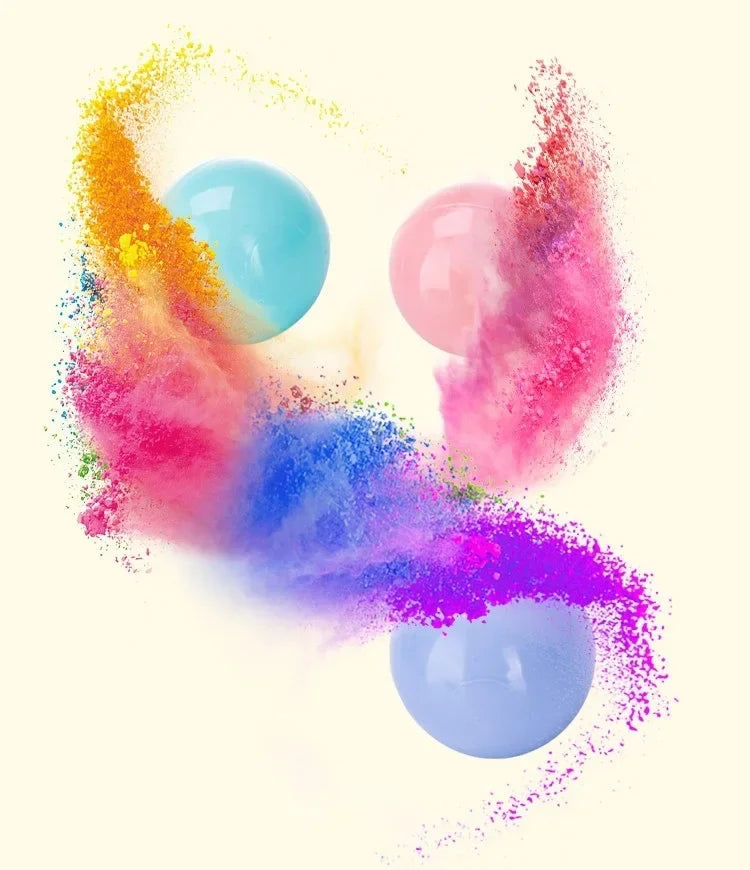A vibrant explosion of colorful powder and light blue and pink balloons against a white background.