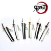 A collection of miniature replica swords inspired by Tanjiro from Demon Slayer, featuring various metal and wooden blades.