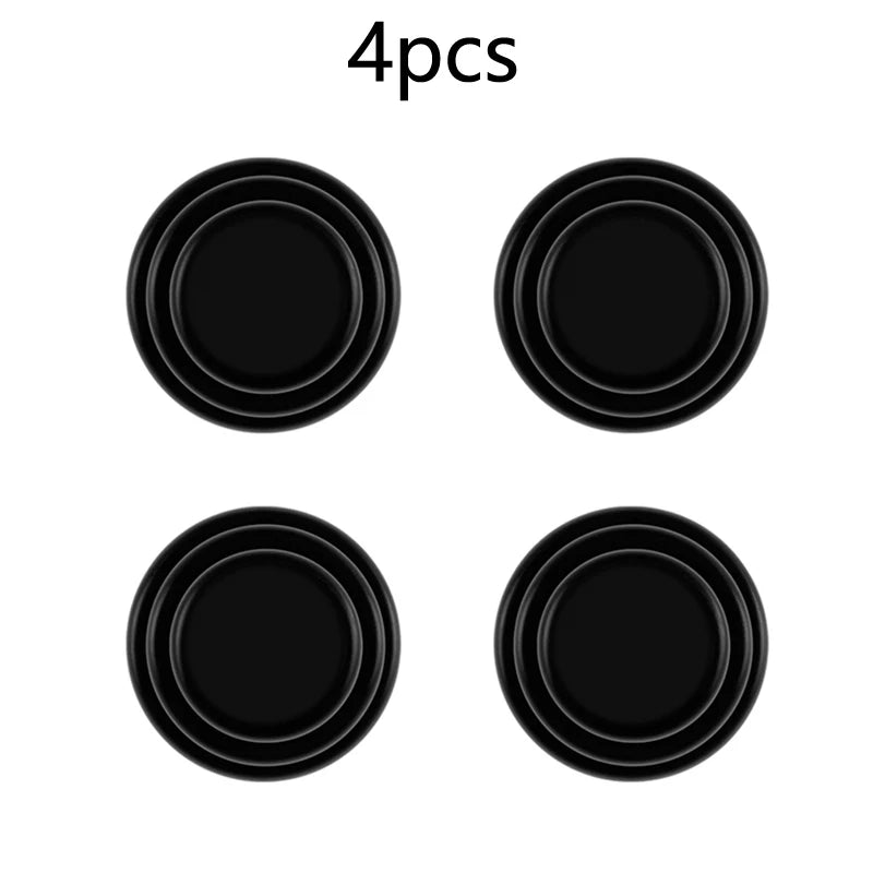 Set of four black circular sound insulation pads for car trunk shock absorption.