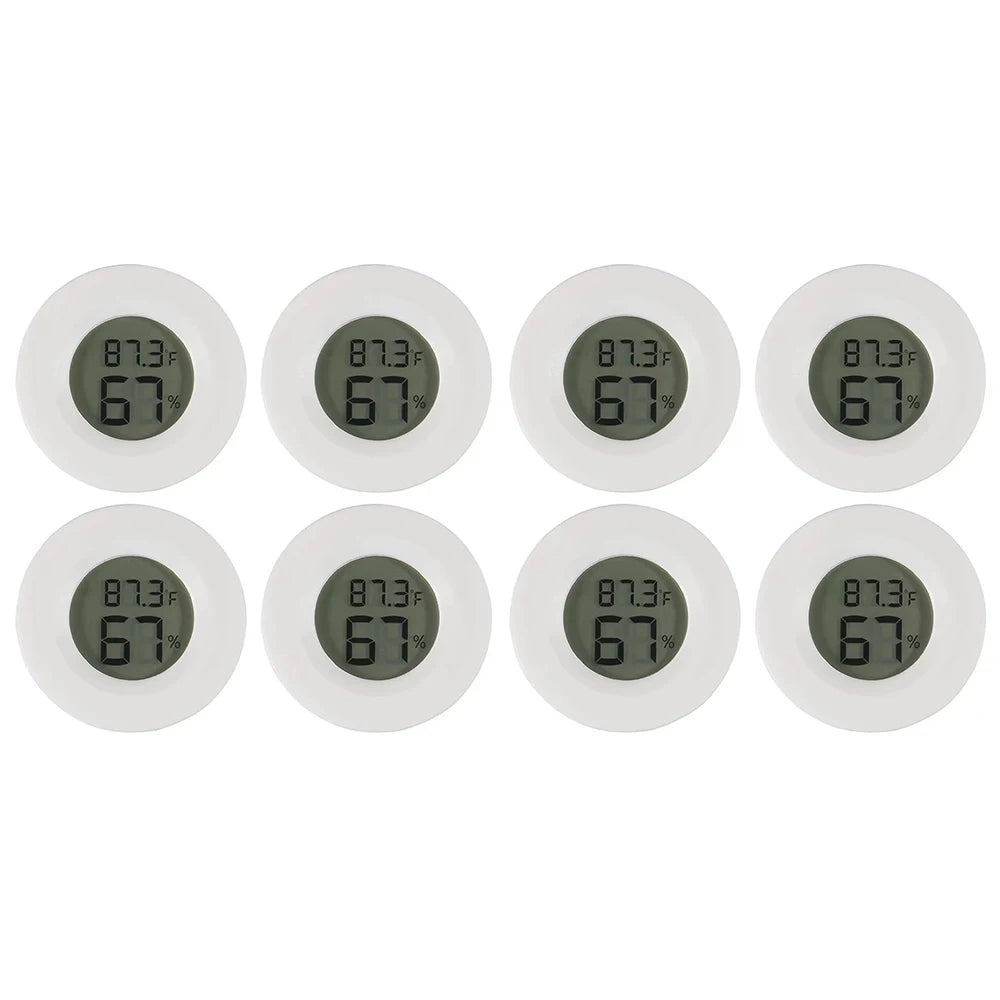 A row of seven white digital thermometers displaying a temperature of 67 degrees Fahrenheit and 87.3 degrees Fahrenheit.
