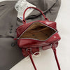 Bolso de hombro suave con detalle de lazo