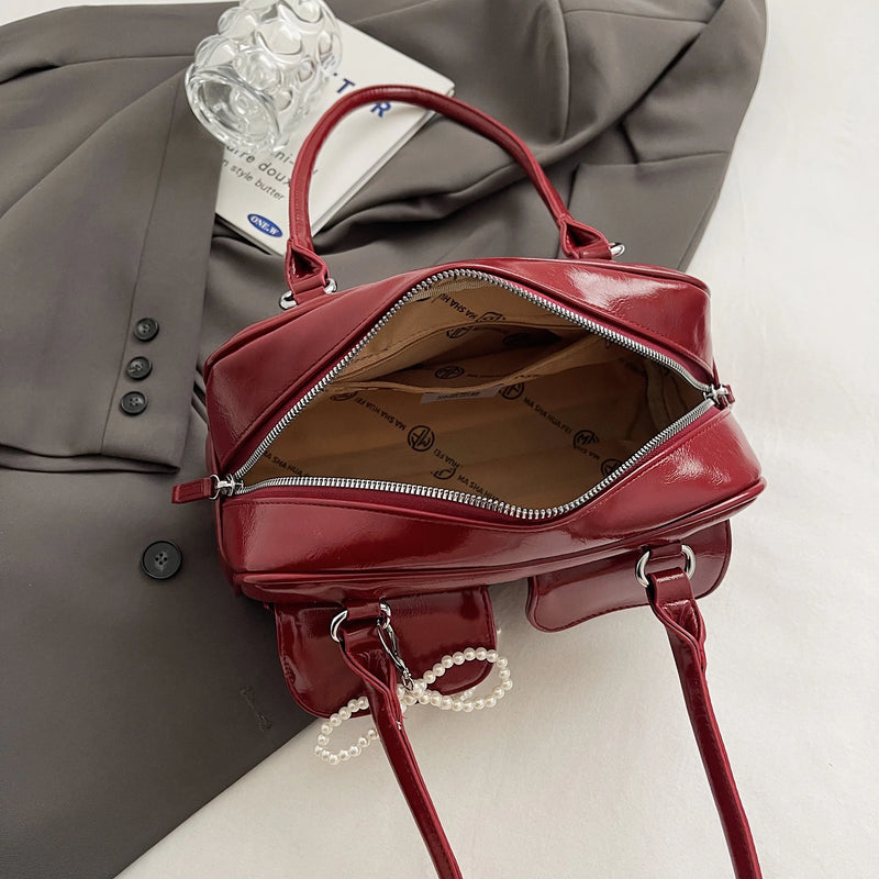 Bolso de hombro suave con detalle de lazo
