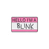 A pink and white enamel pin with the text HELLO I'M A BLINK