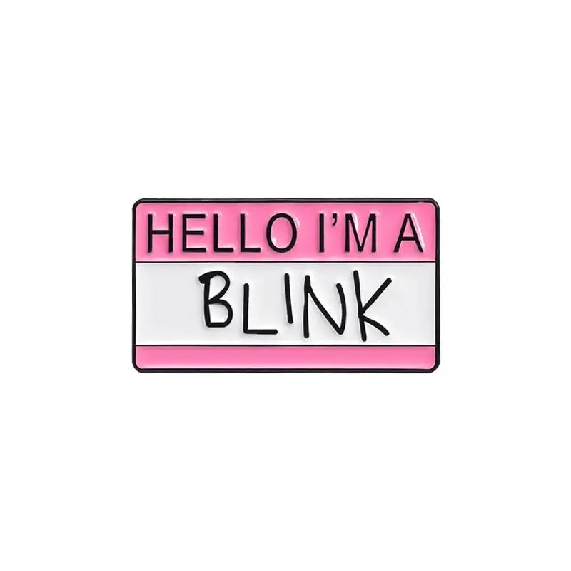 A pink and white enamel pin with the text HELLO I'M A BLINK