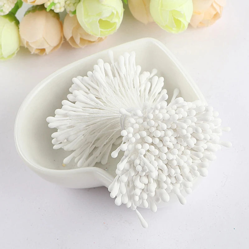 A white bowl holds 400 pearl flower stamens for DIY crafts and wedding decor.