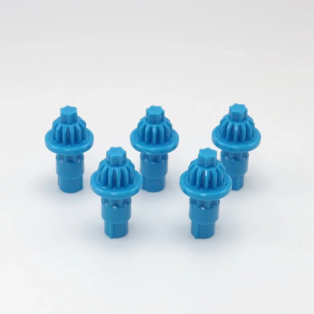 A set of five blue plastic replacement drivers for a battling top, packaged together.