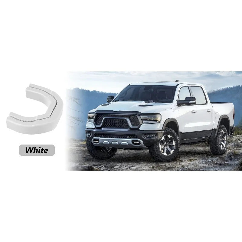 White front tow hook covers for a Ford RAM 1500 pickup truck.