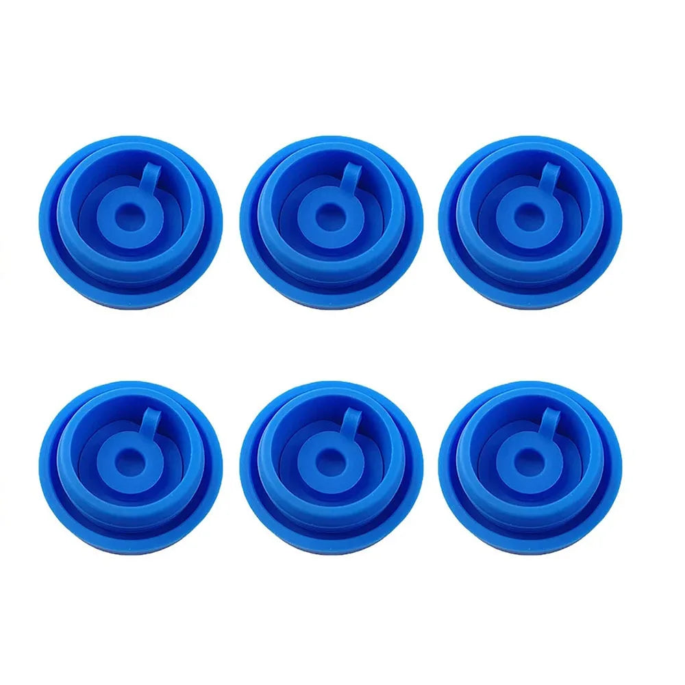 Six blue silicone water jug caps arranged in a row.