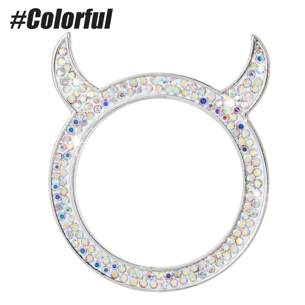 Silver rhinestone ring shaped like a ram's horns with a circular design