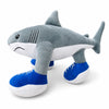 A gray and white plush toy shaped like a shark wearing blue shoes.
