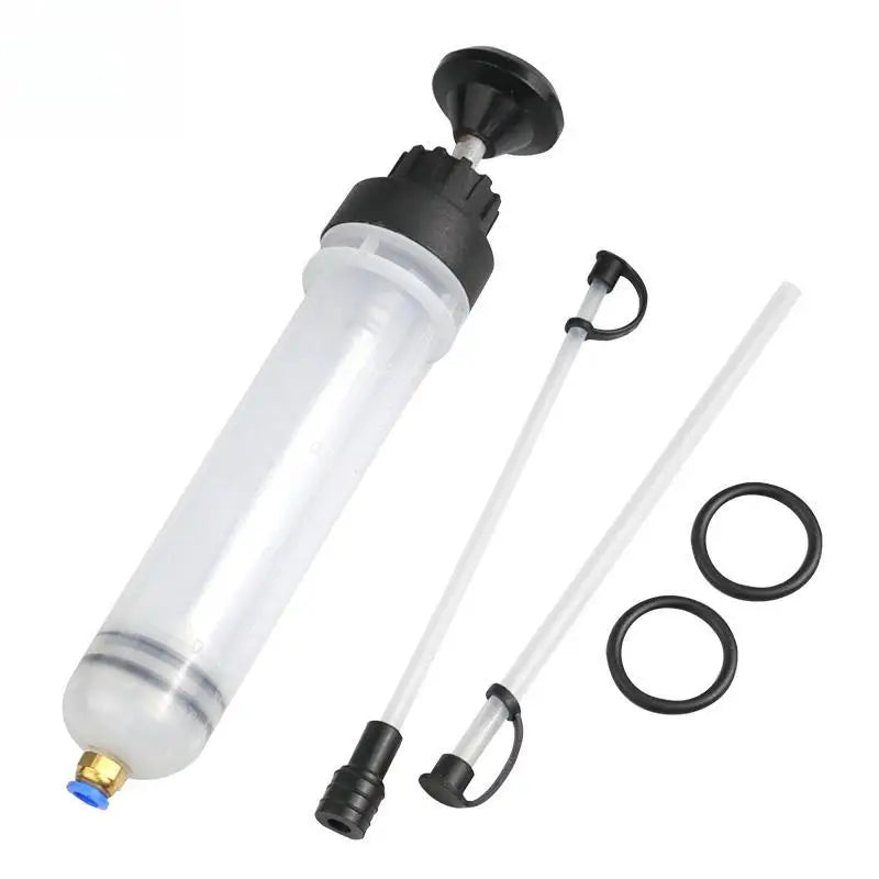 A clear manual fluid extractor and injection pump with a long hose and a black nozzle.