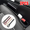 Two black car seat gap filler tools and a storage organizer are shown in a car interior console.