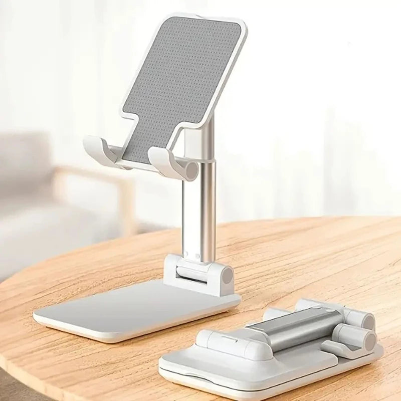 Silberner, faltbarer Handy- und Tablet-Ständer mit flacher Basis und Halterarmen.