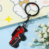 A red Ford Bronco zinc alloy keychain attached to a black ring, set against a light background.