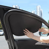 A hand is applying an electrostatic film to a car window, demonstrating the installation of an electrostatic film.