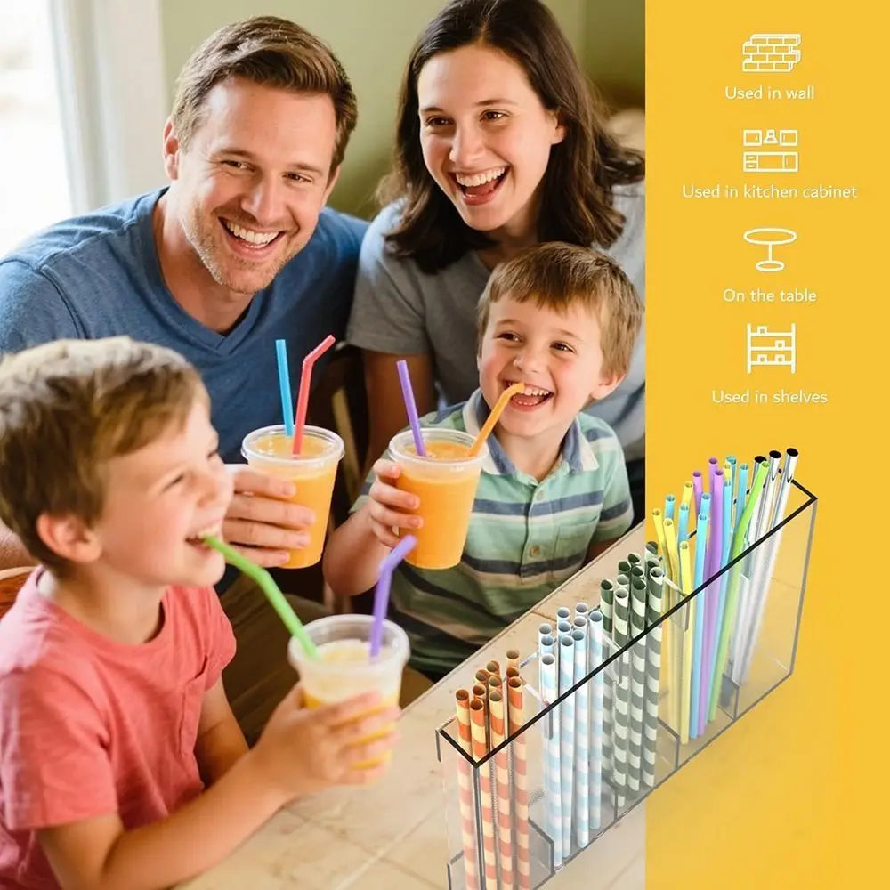A family is using an acrylic wall-mounted straw and utensil holder for various items like straws, spoons, and utensils.