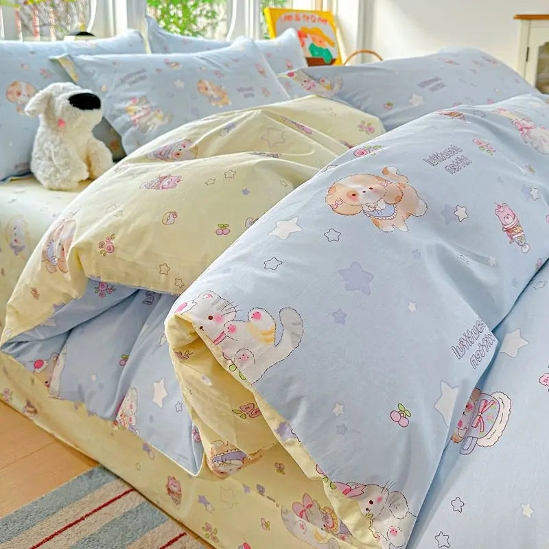 A light blue duvet cover set with yellow accents and patterned pillow shams displayed on a bed.