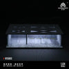 A 1:64 scale miniature garage diorama kit featuring a model car display with internal lighting.