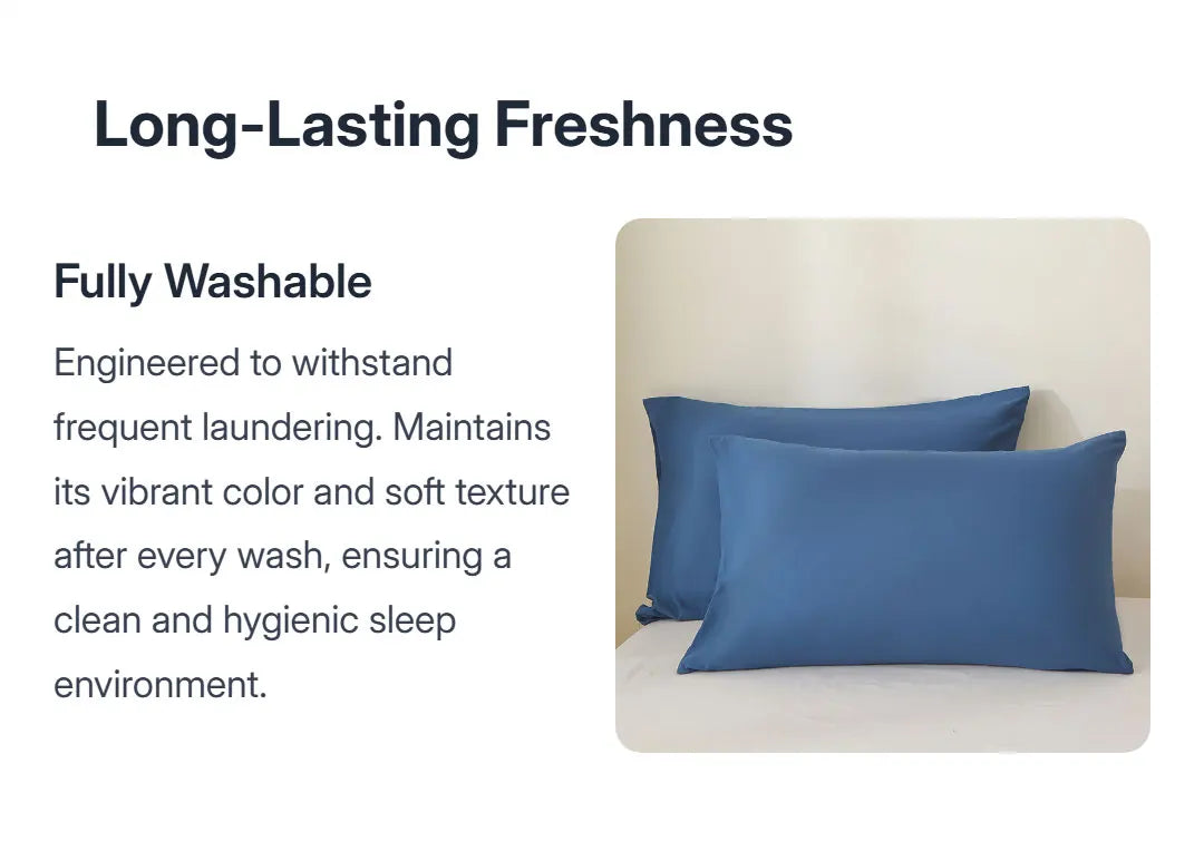A set of solid blue pillow covers displayed on a bed, emphasizing long-lasting freshness and washability.