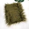 A swatch of olive green faux fur fabric used for DIY sewing, doll hair, and cosplay.