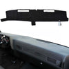 Black custom-fit dashboard cover for a truck or SUV interior.