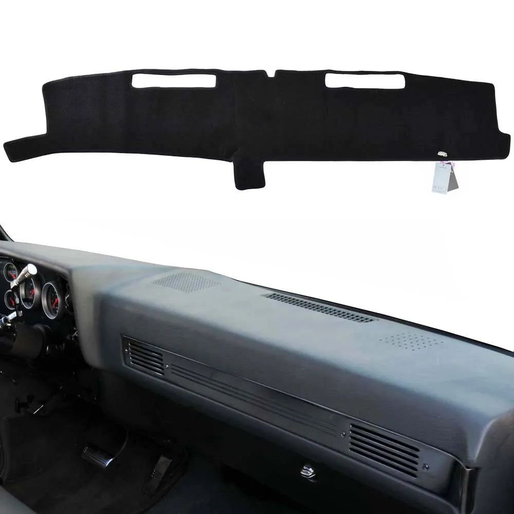 Black custom-fit dashboard cover for a truck or SUV interior.