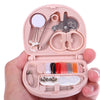 A pink portable mini sewing kit is shown open, displaying various sewing tools and colored threads.