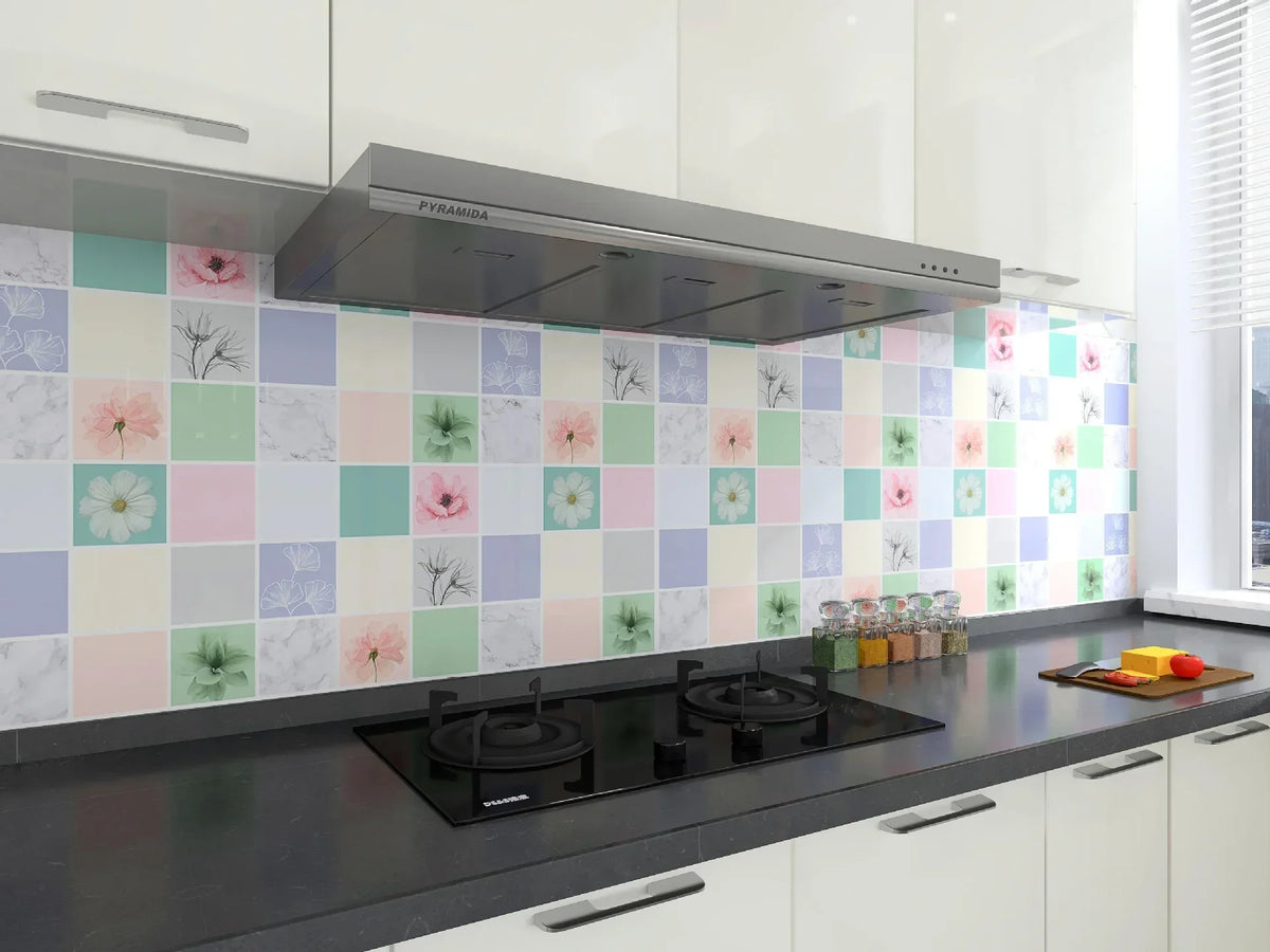 A modern kitchen featuring a stainless steel extractor hood above a speckled floral splashback wallpaper.