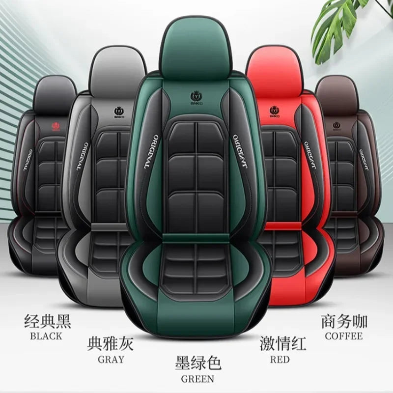 A row of black, gray, green, and red universal car seat covers displayed for sale.