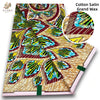 Cotton Satin Grand Wax fabric featuring a vibrant pattern of green, yellow, and blue leaves on a beige background.