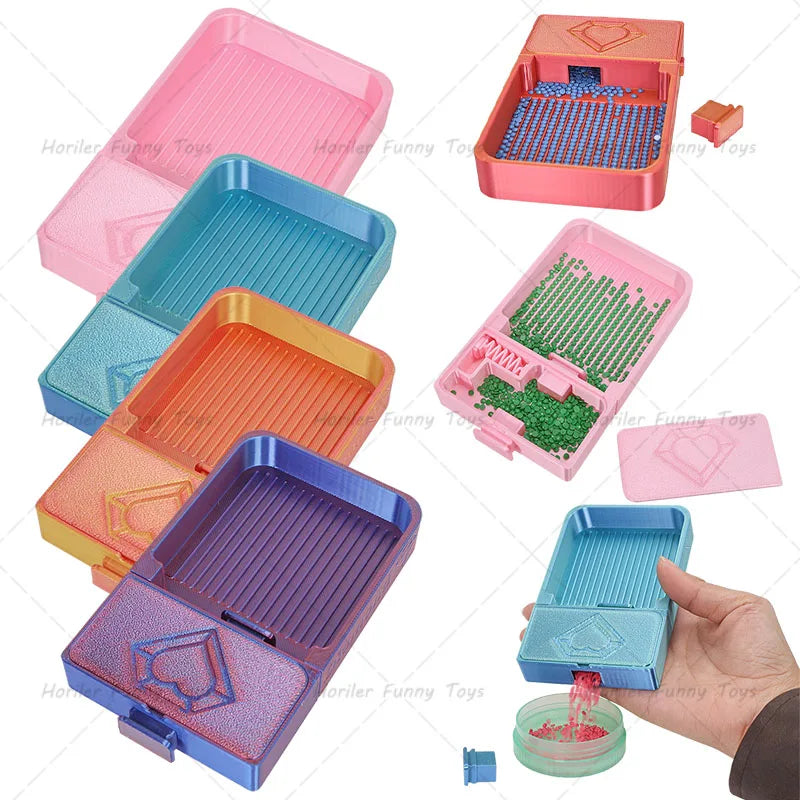 Un set de plateaux pour peinture de diamants roses, bleus, oranges et violets pour la création et le perlage.