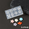 A clear silicone nail art mold with floral designs is displayed next to several colored silicone petals.