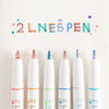 A set of six dual-color fluorescent marker pens arranged in a row against a white background.