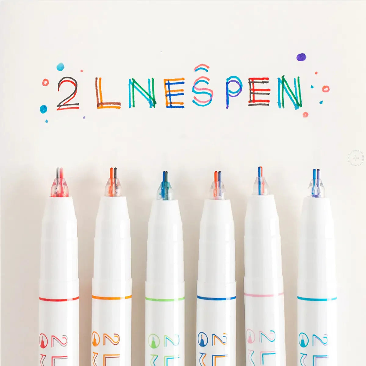 A set of six dual-color fluorescent marker pens arranged in a row against a white background.
