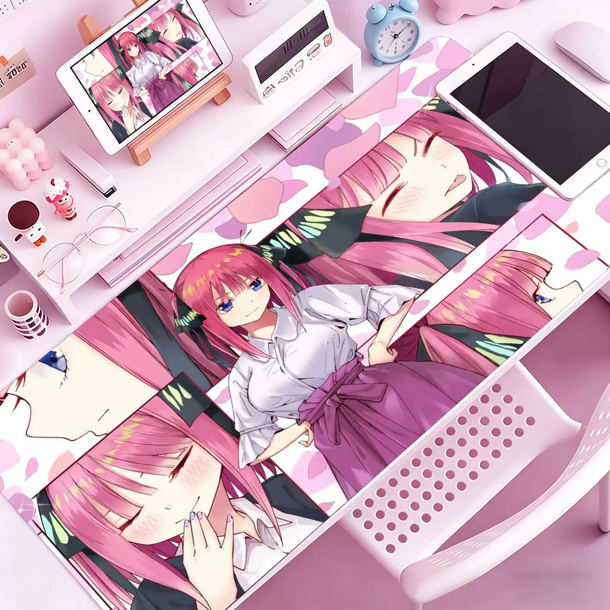 A pink anime character illustration on a mouse pad featuring a girl with pink hair and a white shirt.