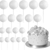Eine Sammlung von 20 weißen kugelförmigen Torten-Toppern auf Stäbchen zur Dekoration angeordnet.