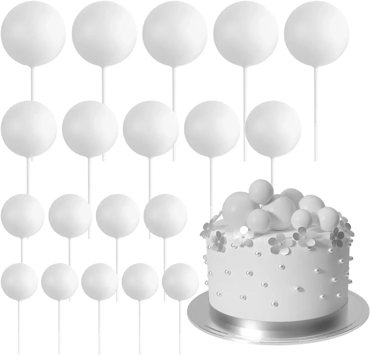 Eine Sammlung von 20 weißen kugelförmigen Torten-Toppern auf Stäbchen zur Dekoration angeordnet.