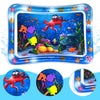 A blue inflatable baby water play mat filled with floating toys and colorful aquatic life.