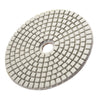 A circular diamond polishing pad with a grid pattern for stone and concrete work.