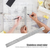 A stainless steel ruler is shown being used to measure on a blueprint or technical drawing.