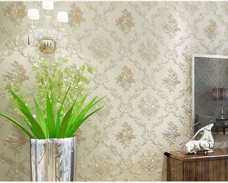 Close-up of a wall decorated with 3D self-adhesive floral wallpaper featuring silver and gold accents.
