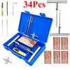 A blue portable tire repair kit containing various tools like wrenches, pliers, and wire cutters.