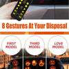 A hand holds a remote control with gesture lights, demonstrating eight gestures on a dark car surface.