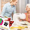A woman is using a white sewing machine with a 6-piece needle threader set for hand and machine sewing.