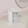 A white clear acrylic hair accessories organizer with rotating compartments displayed on a light surface.